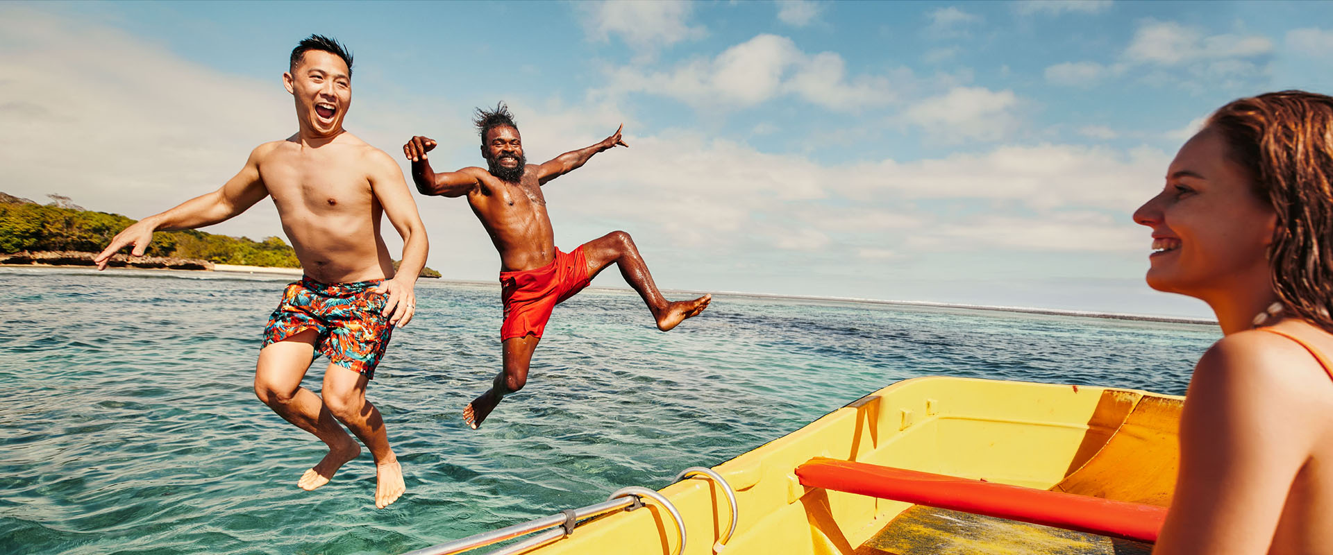Family enjoying kayaking and water activities on a Fiji holiday