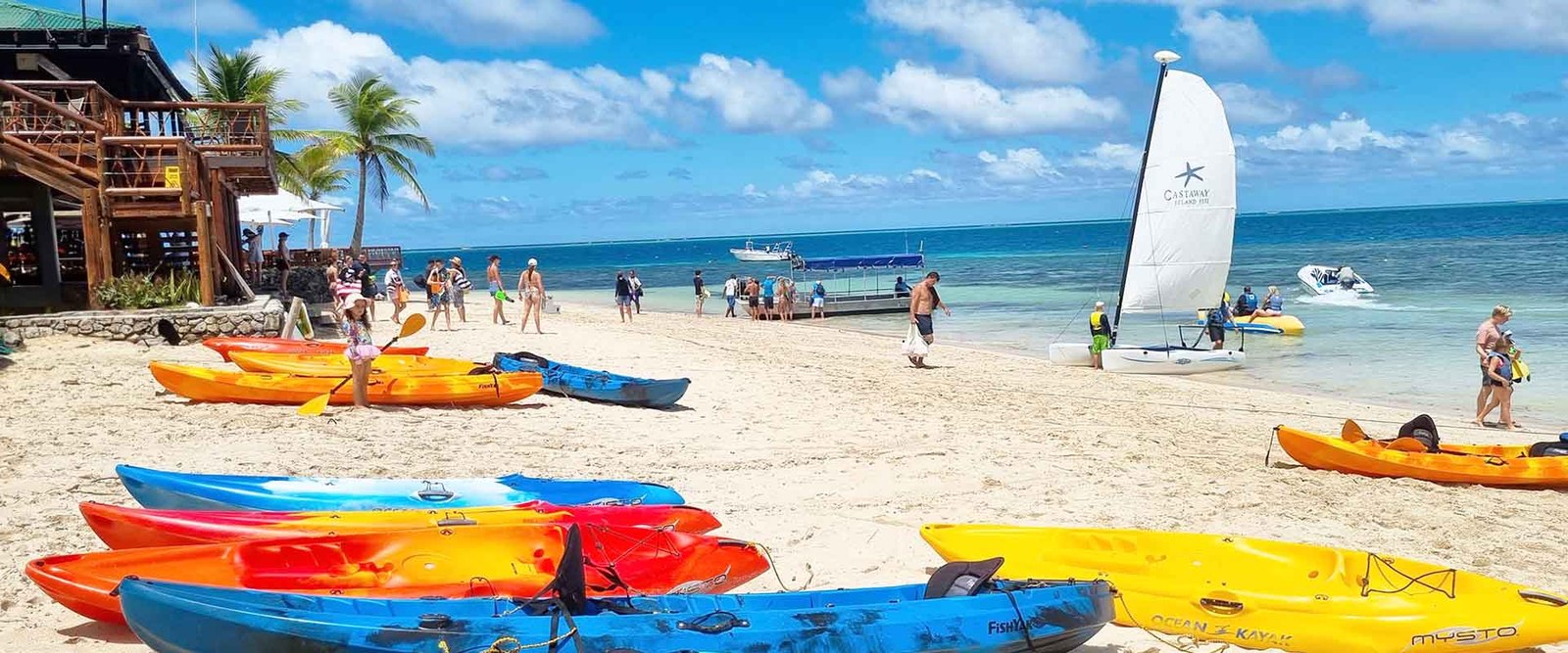 Kayaks and sailing craft on the beach at Castaway Island Fiji