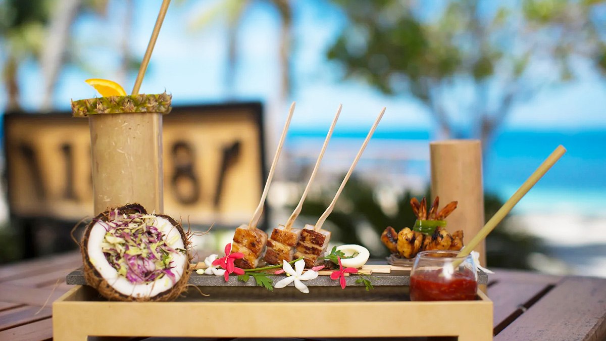 Island dishes and a drink served with an ocean outlook at Castaway Island Fiji