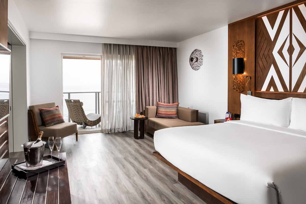 Guest bedroom and sitting area at Crowne Plaza Fiji