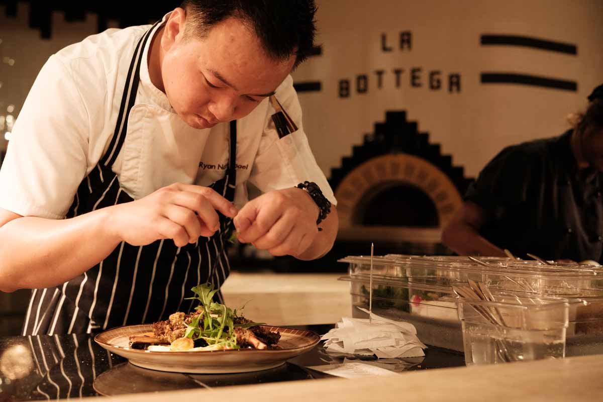Chef finishing a dish at La Bottega in Crowne Plaza Fiji