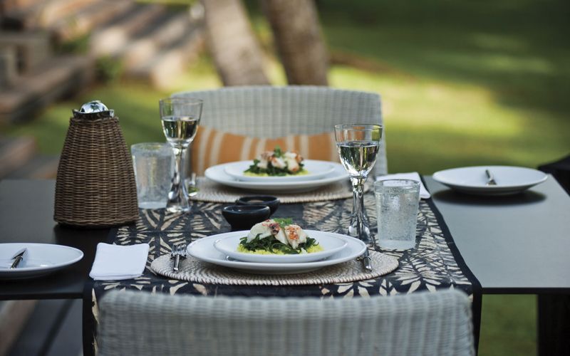 Outdoor dining table set for two at Dolphin Island