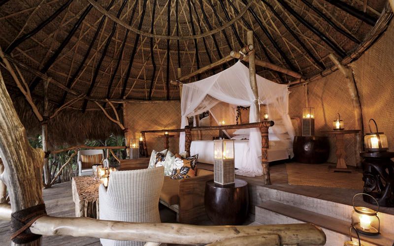Thatched open-air Hilltop Sleep-Out Bure at Dolphin Island