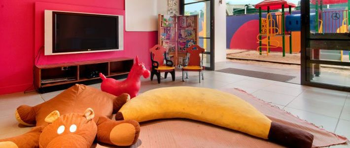 Colourful indoor play area and outdoor playground at Hilton Fiji