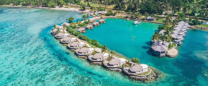 Aerial view of Koro Sun Resort lagoon and its waterfront bures
