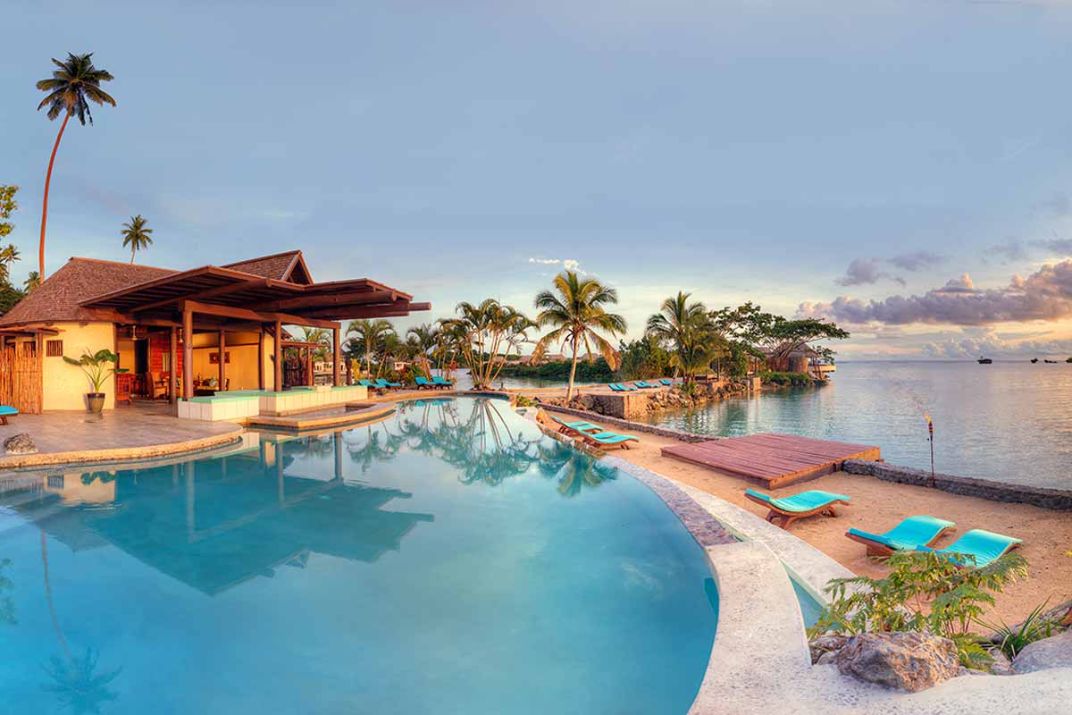 Infinity-edge resort pool overlooking the sea at Koro Sun Resort