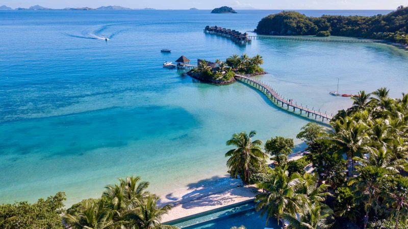 Aerial view of Likuliku Lagoon Resort, Masima Island and its Over-Water Bures