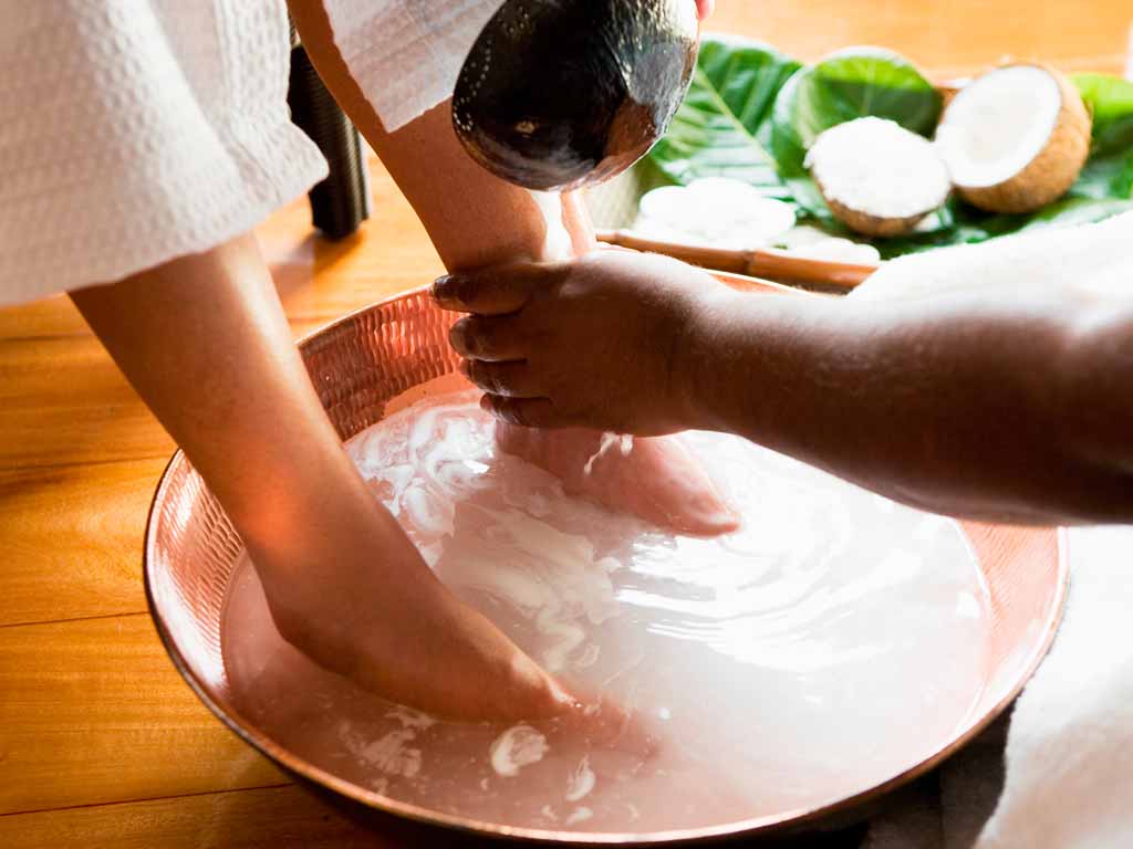 A foot-soak ritual with tropical ingredients at Tatadra Spa, Likuliku Lagoon Resort