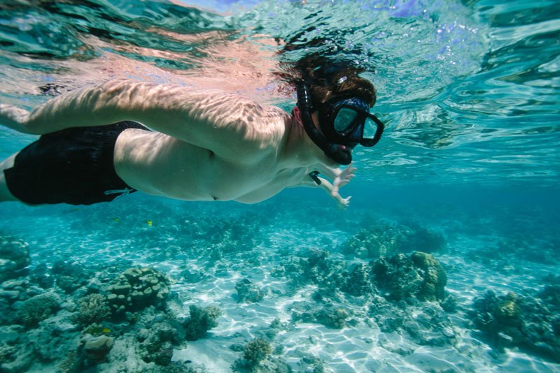 Snorkelling in the clear waters near Lomani Island Resort
