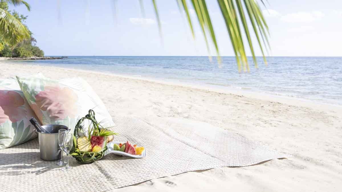 Private beach picnic setting at Lomani Island Resort