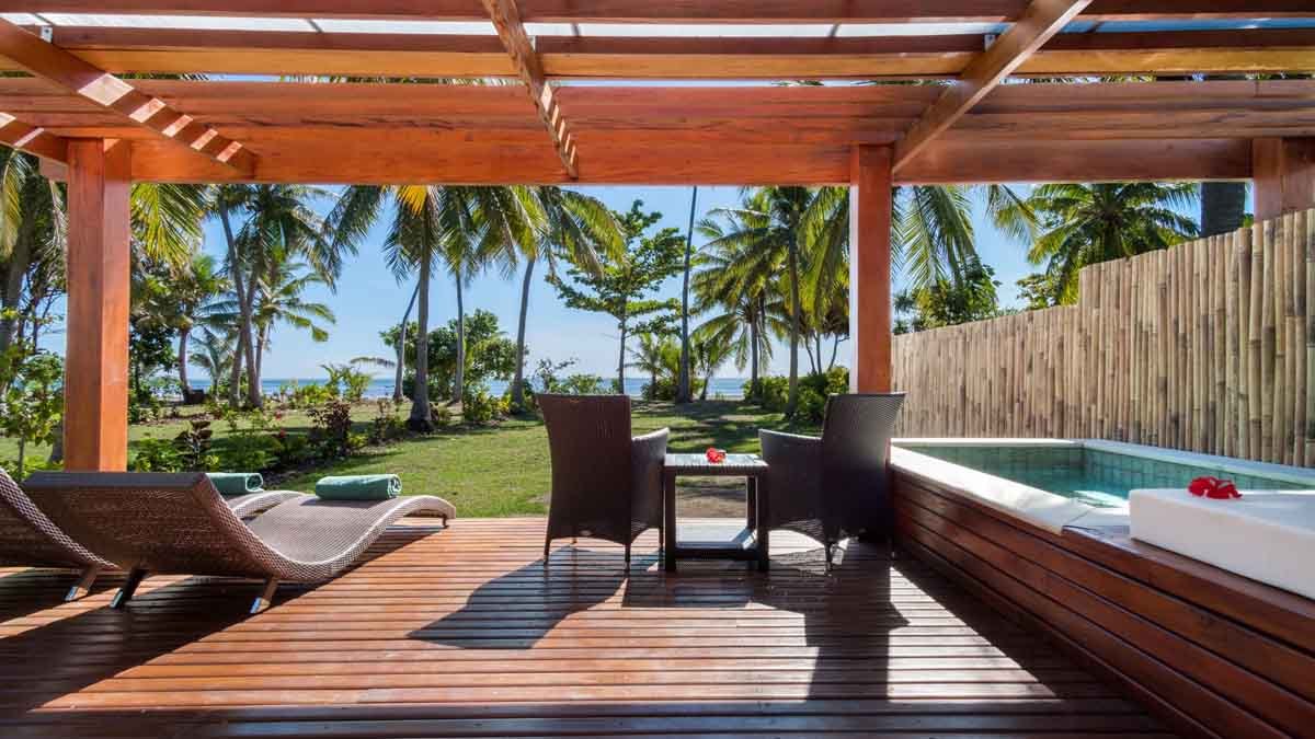 Private plunge pool and covered deck at a Lomani Beachfront Pool Bure