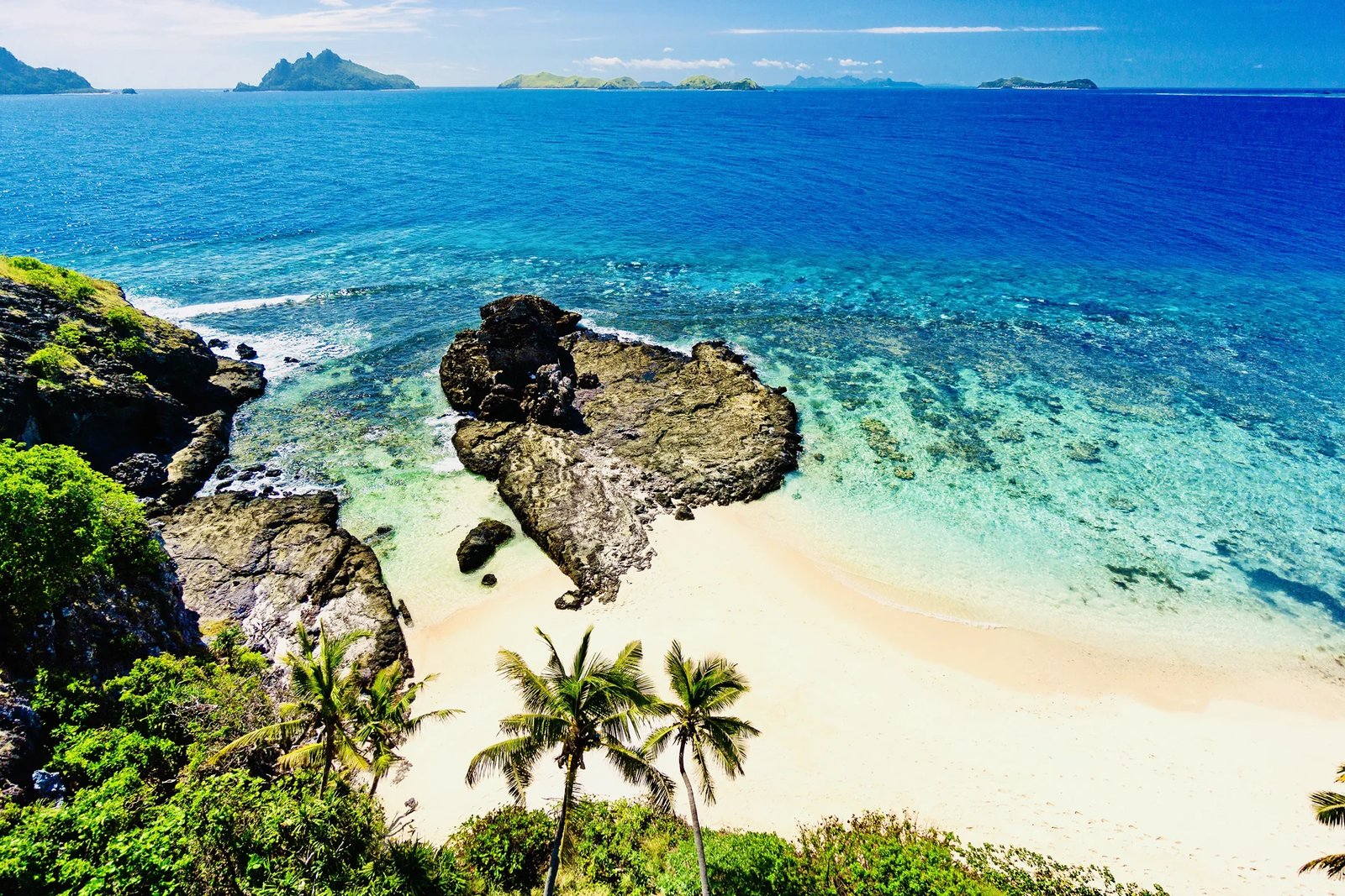 White-sand cove and clear water along Matamanoa Island’s north shore