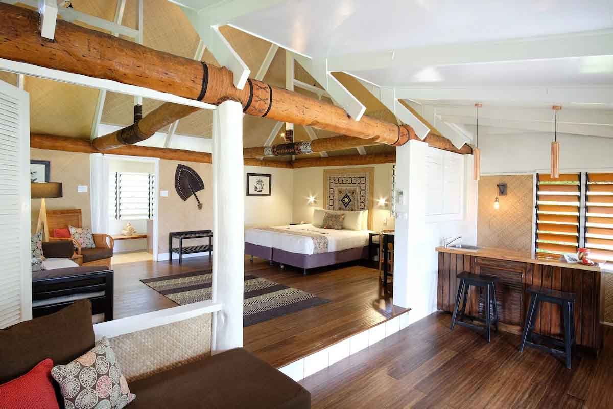 High timber beams and spacious living area in a Musket Cove Beachfront Bure