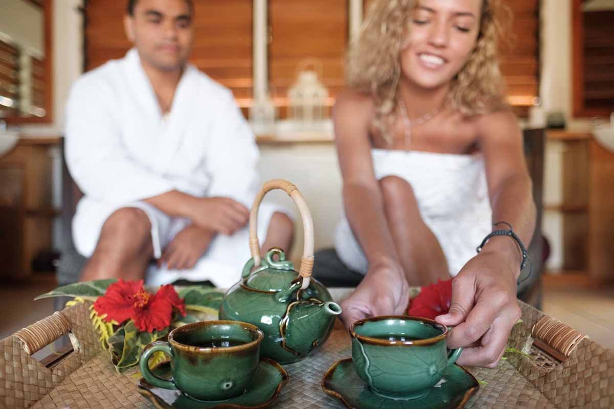A couple relaxing with tea at Makare Spa at Musket Cove Island Resort