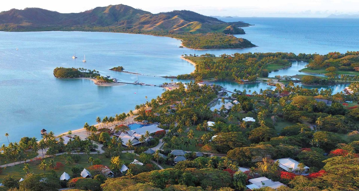 Aerial view across Musket Cove’s gardens, marina and bay on Malolo Lailai