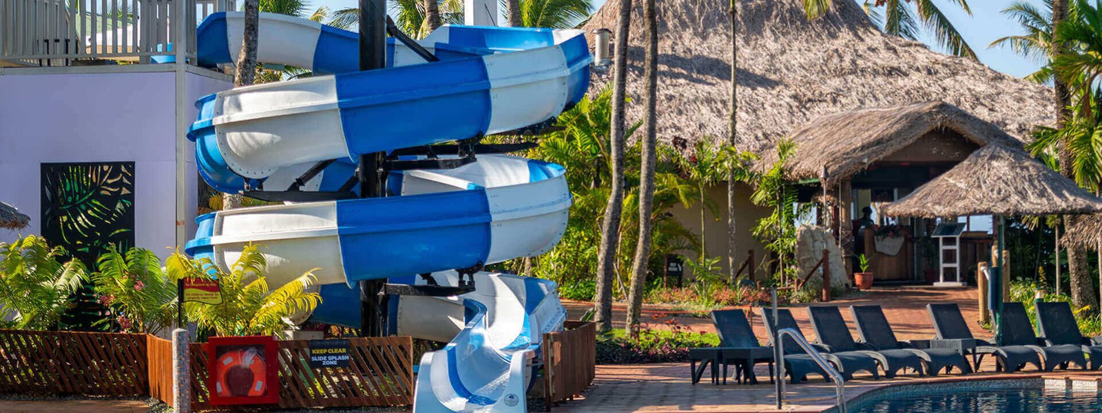 Family swimming pool and waterslide at OUTRIGGER Fiji Beach Resort