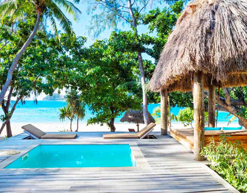 Private plunge pool and beachfront deck of a Paradise Suite at Paradise Cove Resort