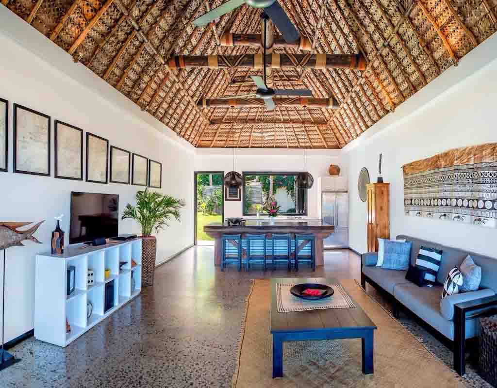 Spacious lounge and dining area in a Beach House at Paradise Cove Resort