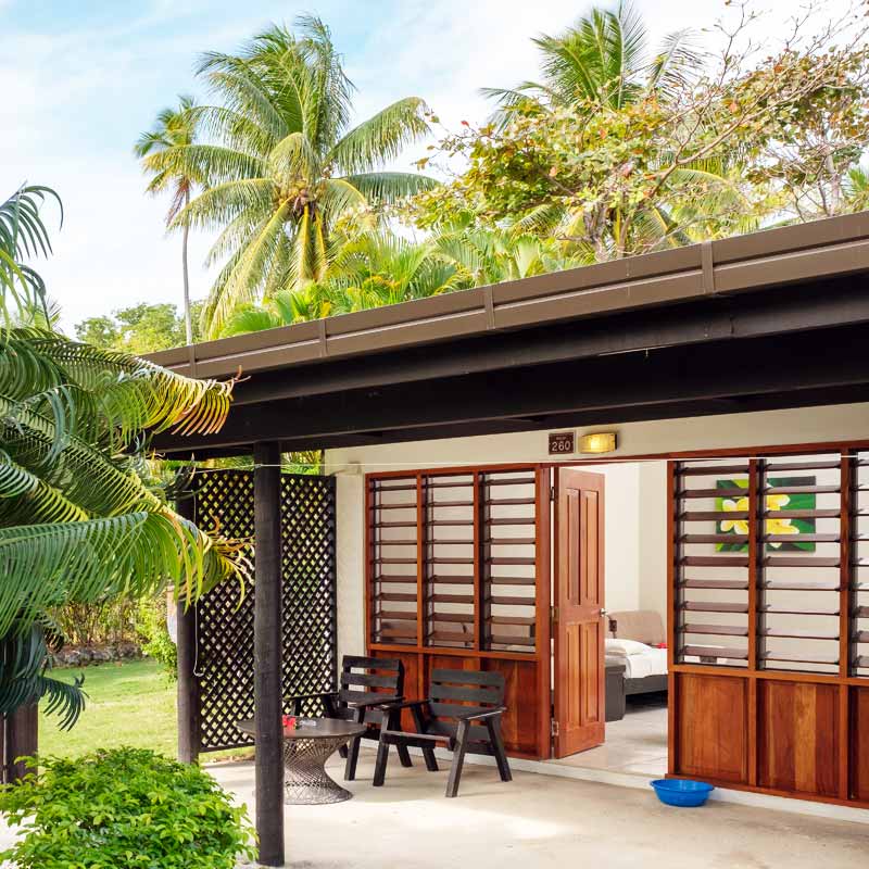 Garden Room patio among tropical plants at Plantation Island Resort