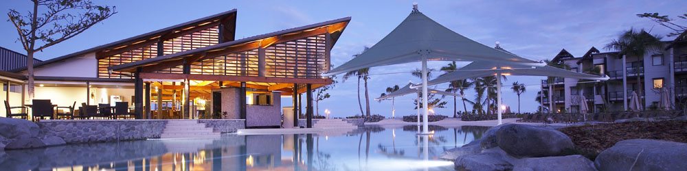 Resort restaurant and poolside outlook at dusk at Radisson Blu Fiji