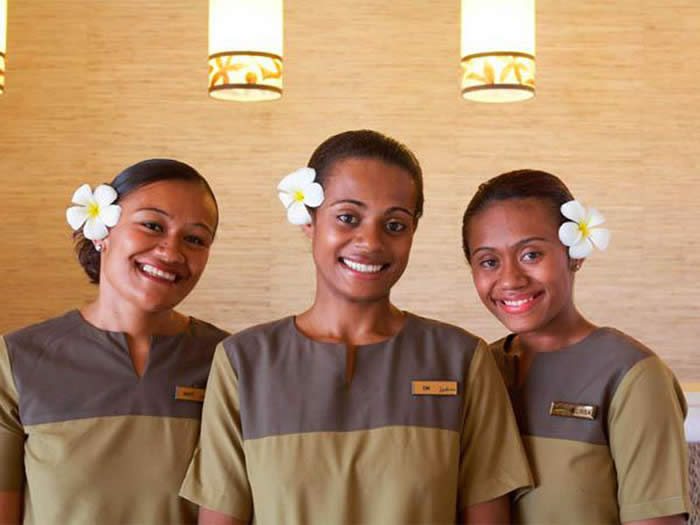 Three welcoming resort team members at Radisson Blu Fiji