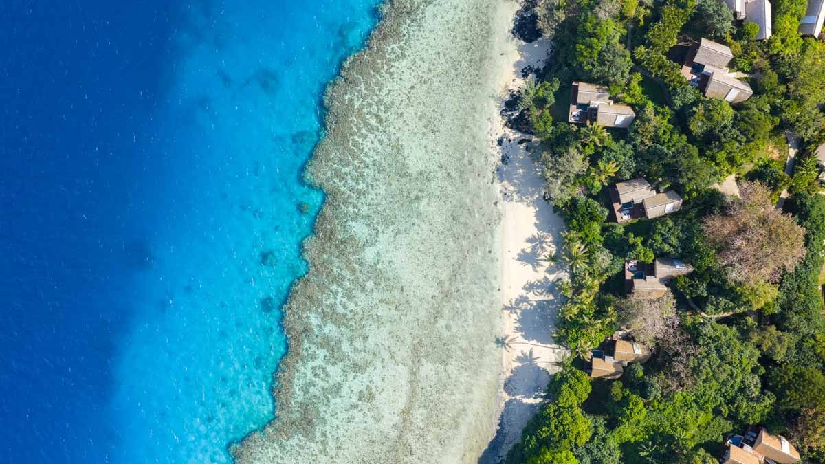 Overhead view of Royal Davui Island’s shoreline and surrounding reef