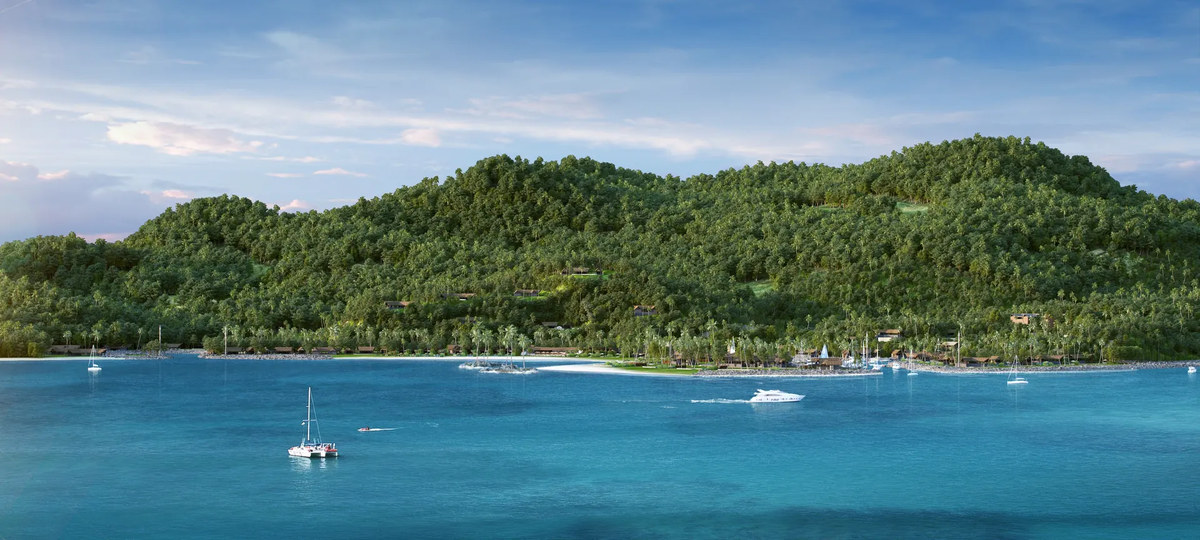 Sailing boats and the forested shoreline of Malolo Island near Six Senses Fiji