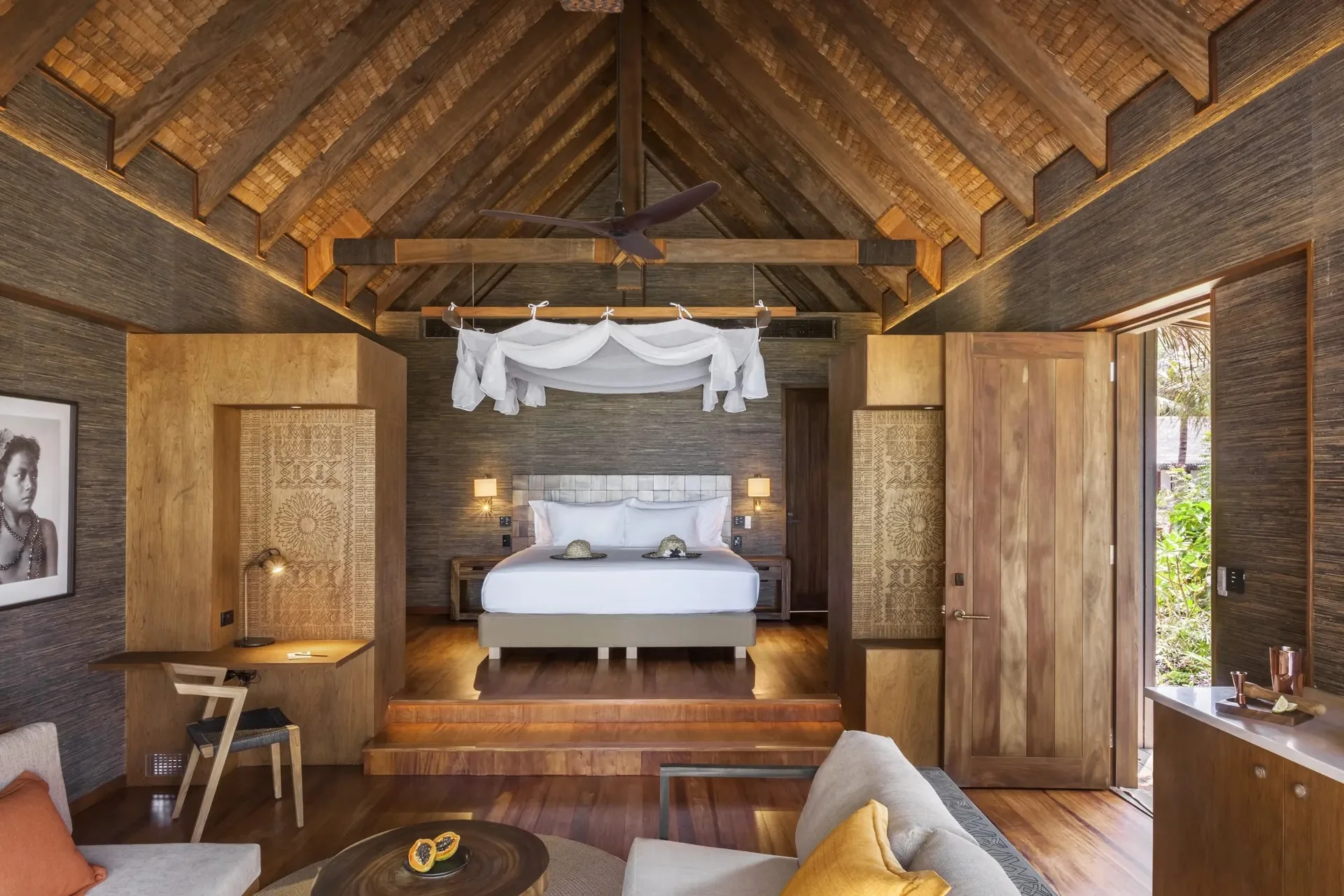 Timber-lined beachfront villa bedroom at Six Senses Fiji