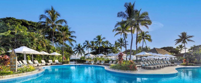 Main lagoon pool and palm trees at Sofitel Fiji Resort & Spa