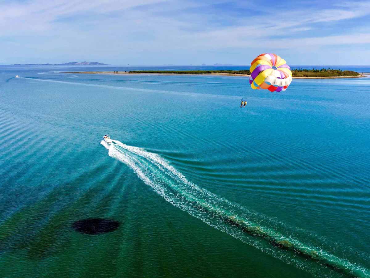Parasailing boat and colourful canopy off Denarau Island