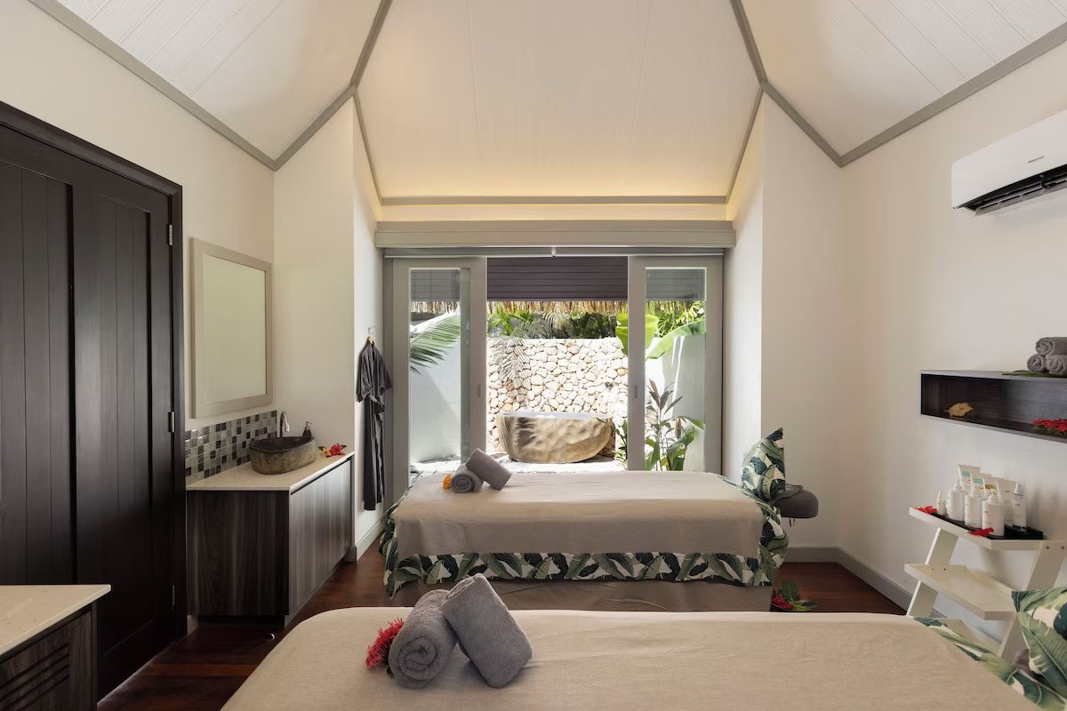 Twin treatment beds in a spa bure at Sofitel Fiji Resort & Spa