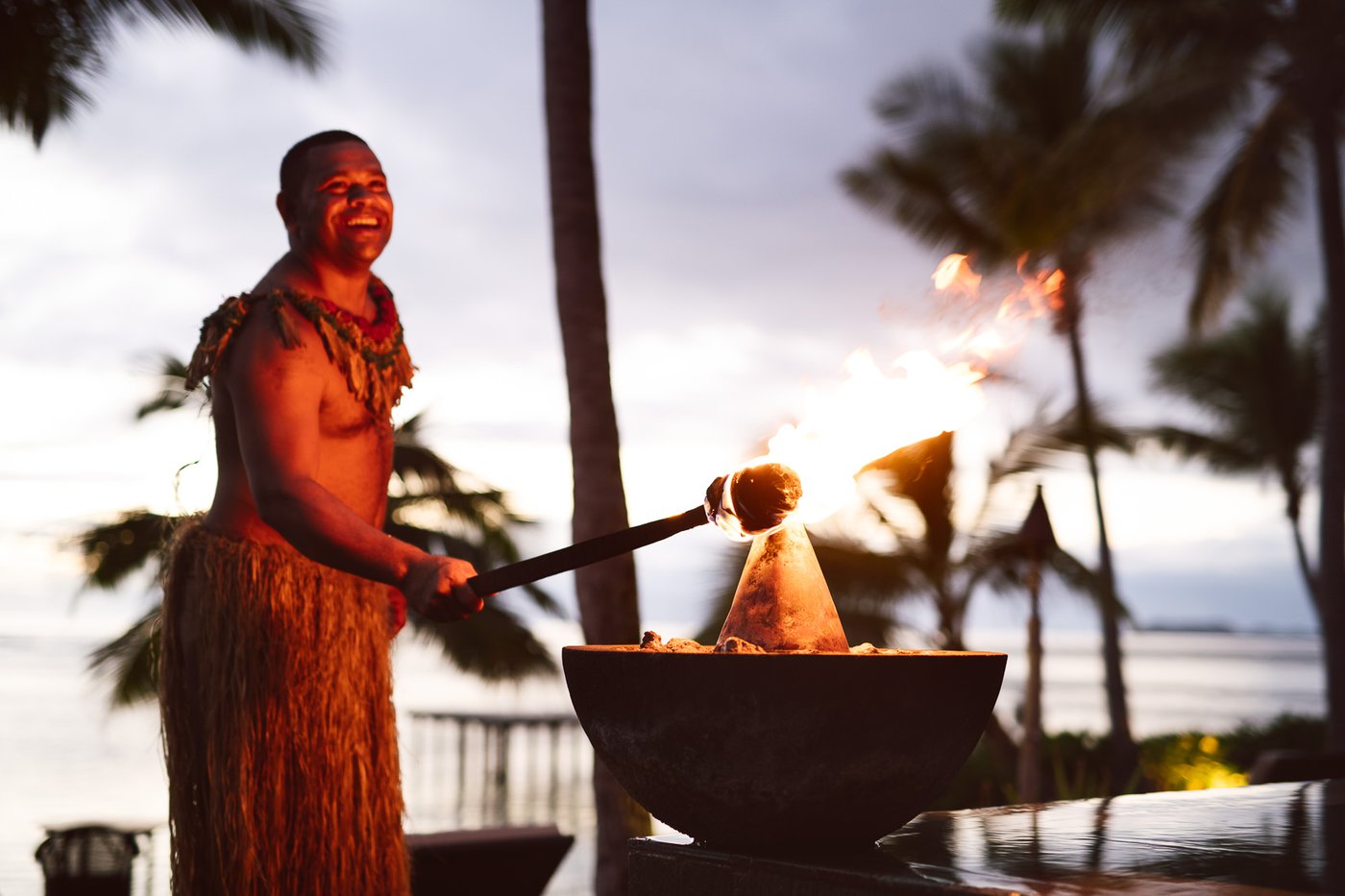 Sunset torch-lighting at Tokoriki Island Resort