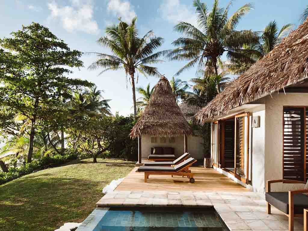 Beachfront Pool Villa deck, personal pool and daybed cabana at Tokoriki Island Resort