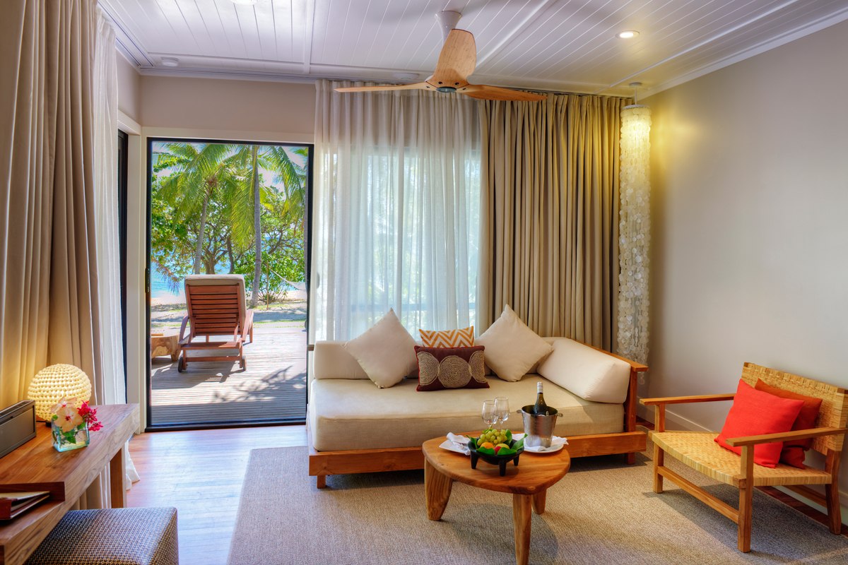 Beachfront Villa sitting area and deck at VOMO Island Resort