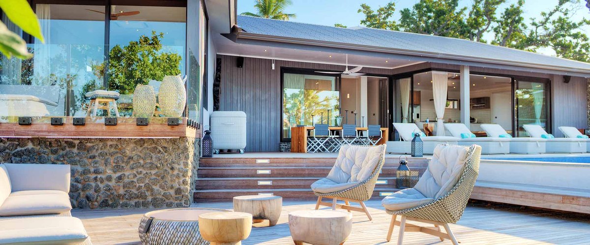 Outdoor living spaces at The BeacHouse residence at VOMO Island Resort