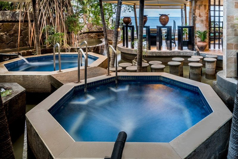 Spa bathing pools and lagoon outlook at The Warwick Fiji