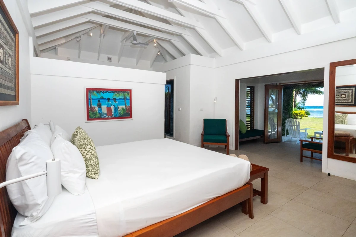King bedroom opening to the oceanfront patio at Waya Island Resort
