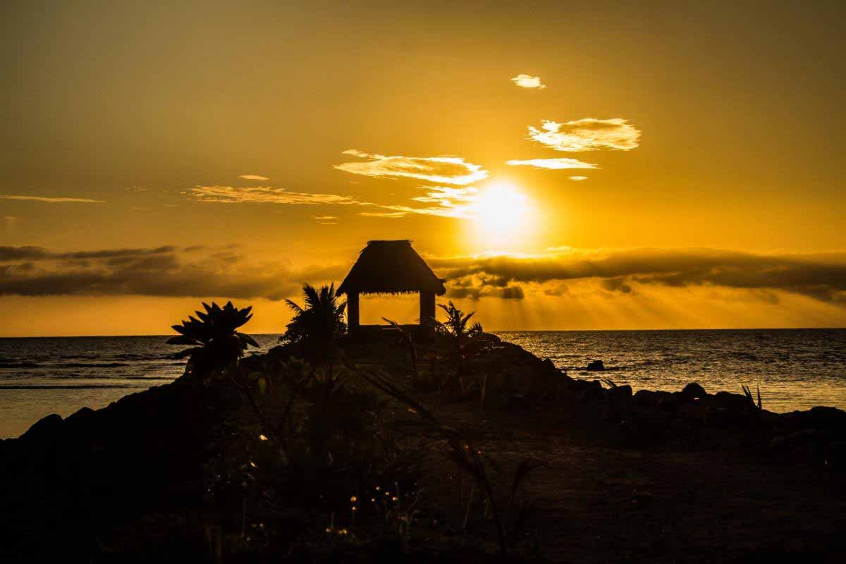 Sunset over the coastal dining bure at Waya Island Resort